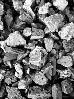 Grinin farklı tonlarında büyük taş molozların dokusu, arka plana yakın üst görünüm