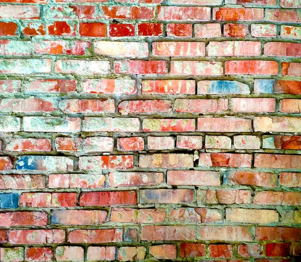 Texture d'un vieux mur de briques en briques rouges avec du blanc et quelques briques bleues pour l'arrière-plan, fond coloré — Photo