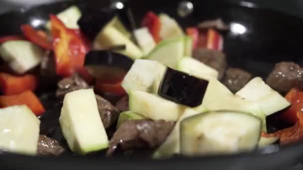 The process of cooking vegetables in a pan at home. Fried vegetables with meat, cooked. useful product — Stock Video