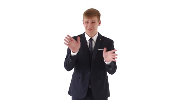 Portrait of a young man in a business suit with blond short hair, expresses certain dislike, is disgusted, does not want, shows gestures with arms crossed, saying NO on a white background.Businessman — Stock Video