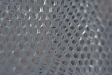 Arkaplan olarak altıgenlerin basit bir beyaz doku deseni