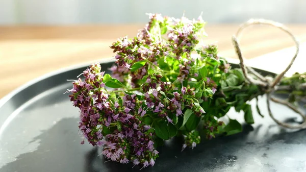 oregano bouquet liying on the table, marjoram bouquet with aroma tea