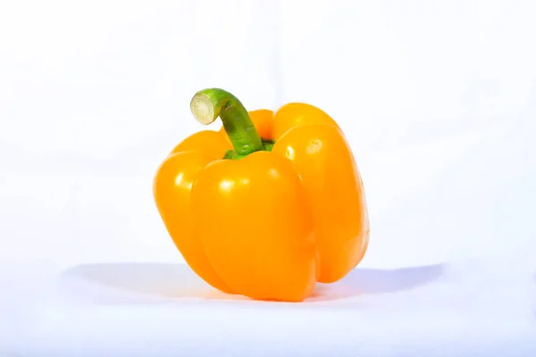 One yellow sweet pepper, isolated on white background. Theme food, ingredients, healthy, vegetables