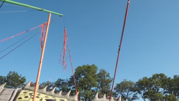 Baby jumps on a trampoline. — Stock Video