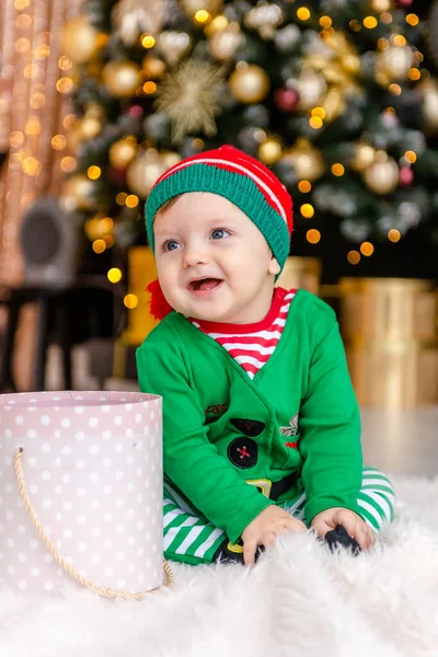 Cute Little Boy Dressed Elf Opens Christmas Present Decorated Christmas — Stock Photo, Image