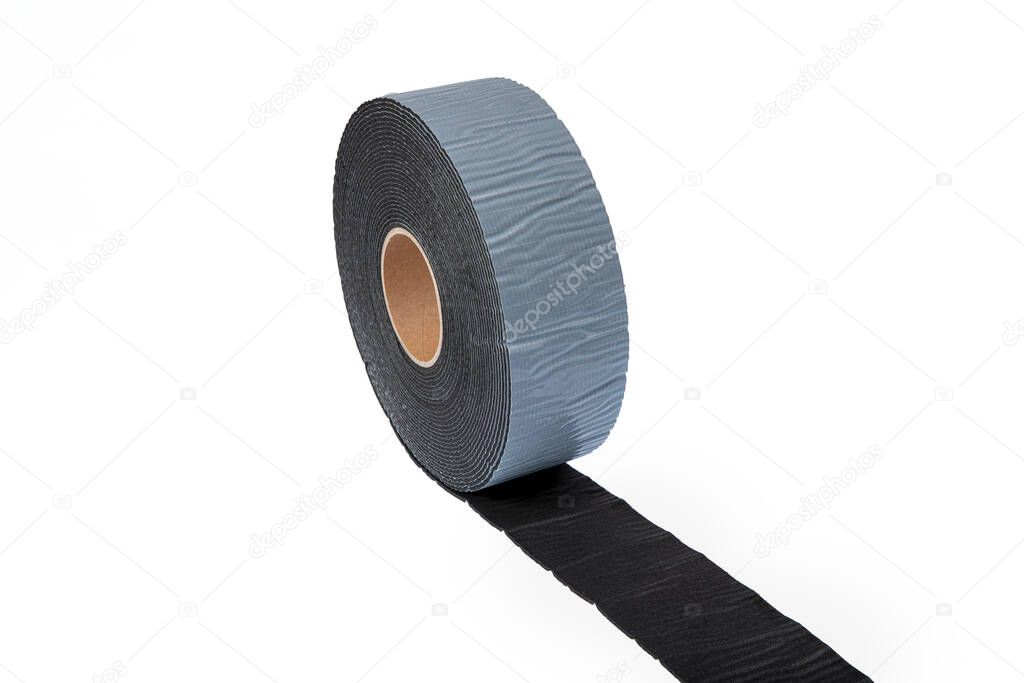 Black industrial tape in roll on white background. Rubber insulating tape. Sound insulation adhesive tape.