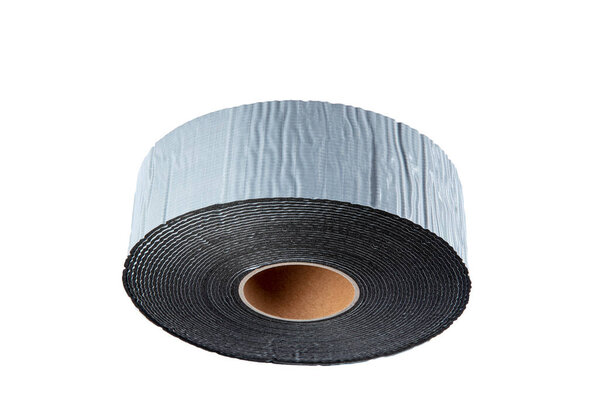 Black industrial tape in roll on white background. Rubber insulating tape. Sound insulation adhesive tape.