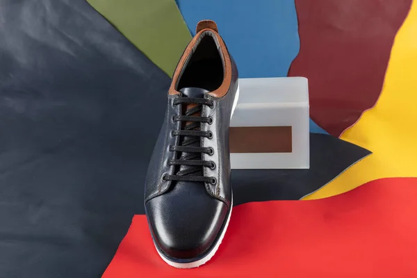 handmade leather men shoes on colored background. men fashion show on colored leather background.