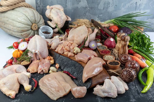 Butcher,  chicken department. Several products displayed in a showcase  raw chicken carcass in delicatessen section.