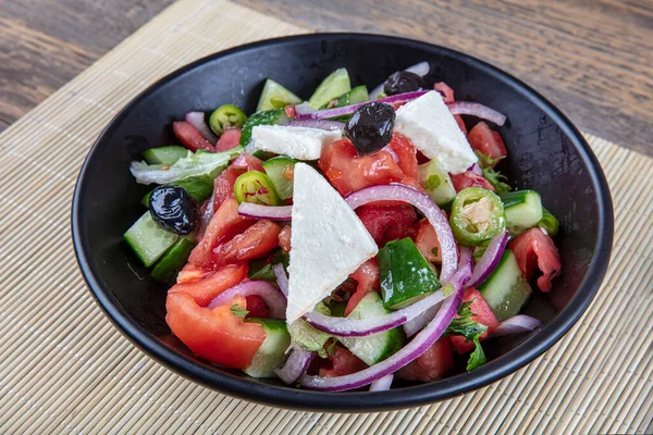 Food cooking restaurant menu. Vegetable salad in a round white plate. Seasonal restaurant menu. Salad vegetable menu. Healthy eating Diet.
