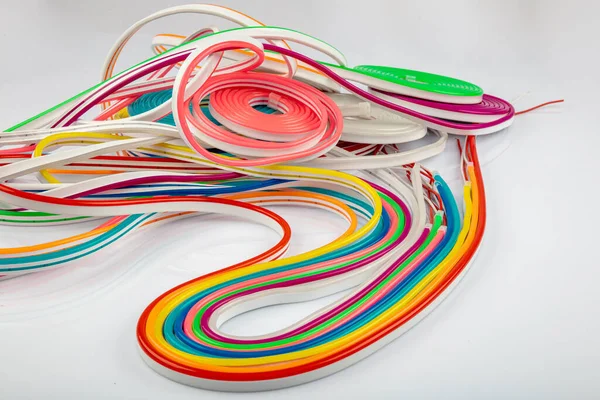 Neon flexible strip light. Flexible led tape neon flex in different colors on white background.