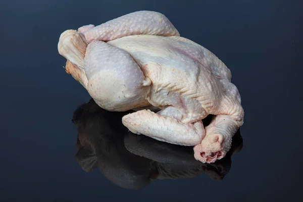 Raw whole chicken. Raw fresh chicken. isolated on black background. Healthy food, diet or cooking concept.