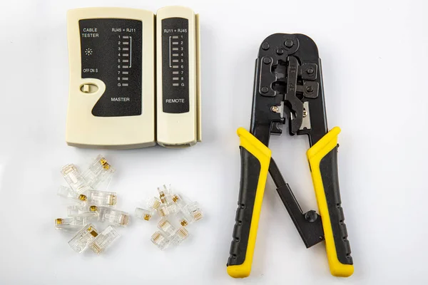 Network Tool Kit Professional, Cat6 Cat5e EZ Rj45 Crimp Tool, 8P8C RJ45 Connectors, Cable Tester, Stripping Pliers Tool Set. Data crimp tool kit isolated on white background.