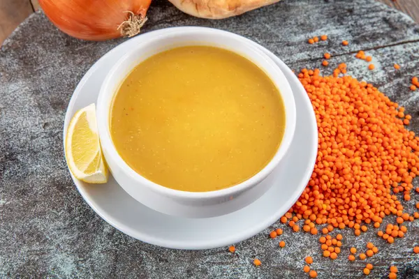 Lentil soup (Turkish: Mercimek corbasi ) on the wooden table. — Stock Image Lentil Soup Turkish Mercimek Corbasi Wooden Table Royalty Free Stock Photos
