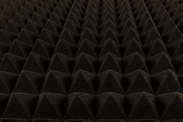 Sound proof Acoustic black gray foam absorbing, pyramid style padding layer panel for voice recording studio attach on wall as wallpaper background to reduce and protect sound to outside room