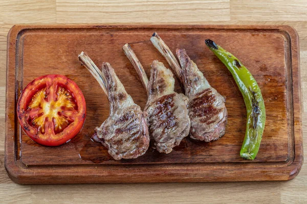 Meat Wooden Plate Roast Ribs Wood Tomatoes Pepper Dry Spices — Stock Photo, Image