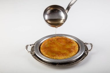 Turkish dessert kunefe, kunafa, kadayif with pistachio powder and cheese, served hot, very sweet. Turkish traditional dessert. clipart