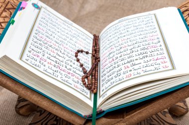 Istanbul Turkey 11 February 2022; Quran and tasbih on prayer rug. Islamic concept, The holy Quran on a praying matt . 
