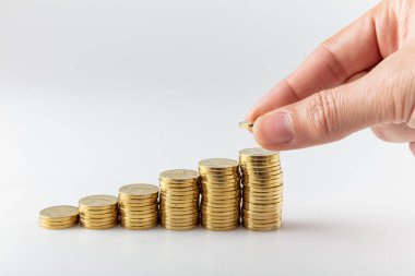 Bozuk paralar farklı pozisyonlarda üst üste yığılmış. Türk lirası. Emlak ve ipotek.