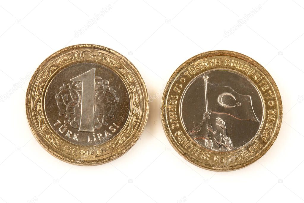 One Turkish Lira closeup isolated on white background. Stacks of Turkish coins, one lira special version.