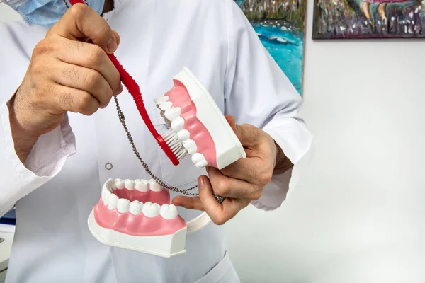 Teeth doctor gives tooth brushing training to sick people.