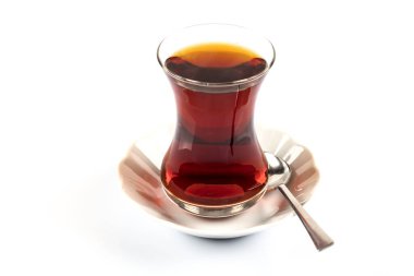 glass cup of tea with red and white sugar