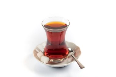 cup of tea with a glass of red wine and a saucer on a white background