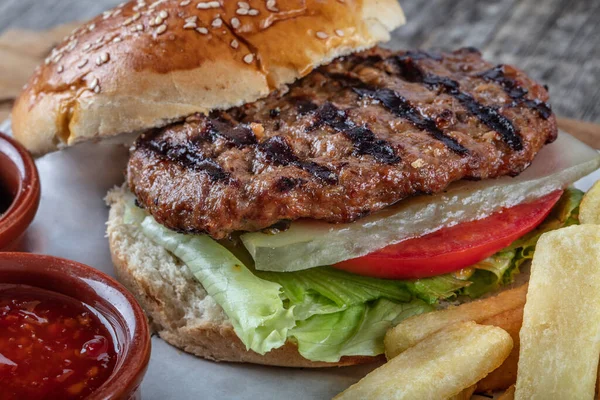 delicious burger with meat and vegetables