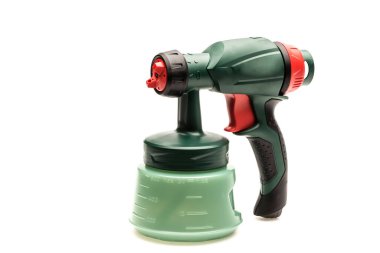 Green spray gun isolated on white background