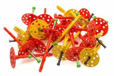 colored plastic dowels and colored plastic screws isolated on a white background