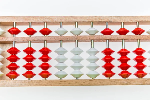 Traditional counts/abacus with colorful wooden beads on gray background. Toy abacus to learn counting. Colorful children counting frame for kids. Counts show: one, two, three, four, five. Copy space.