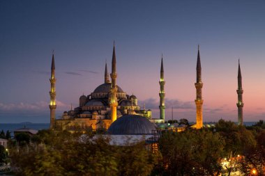 istanbul city view. blue sky with clouds, illuminated domes of suleymaniye mosque. turkey
