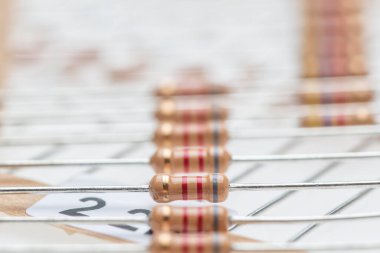 Resistor passive two-terminal electrical component for electrical resistance to reduce current flow and lower voltage level within the circuit.