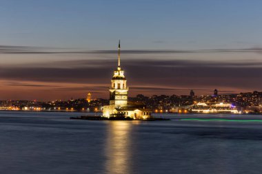 Istanbul, Turkey-July 27, 2019: illuminated Maiden's Tower at the sunset