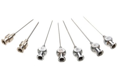 big metal needles on a white background