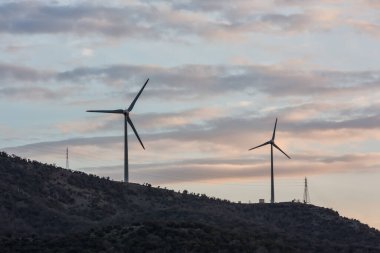 wind energy in the countryside with cloudy blue sky