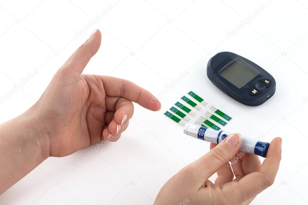 Glucometer and syringe for insulin, monitoring of diabetes mellitus isolated on white background.