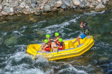 Rize, Turkey - July 24,2015 :Tourists who rafting on the river storm(Firtina Deresi) Rize, Turkey. Photo taken from Rize City, Turkey.