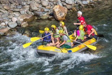 Rize, Turkey - July 24,2015 :Tourists who rafting on the river storm(Firtina Deresi) Rize, Turkey. Photo taken from Rize City, Turkey.