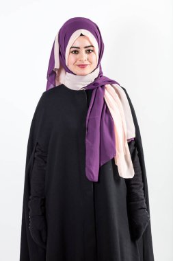 beautiful Muslim woman in a purple hijab