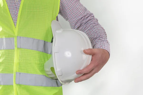 engineering management construction ,engineer hold in hand safety helmet for workers security on working site background. busines concept. construction worker holding helmet on gray background with copy space