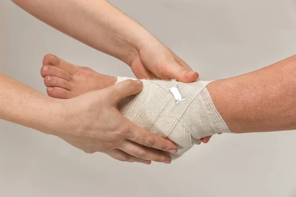 Pair Hands Holding Bandage White Background — Stockfoto