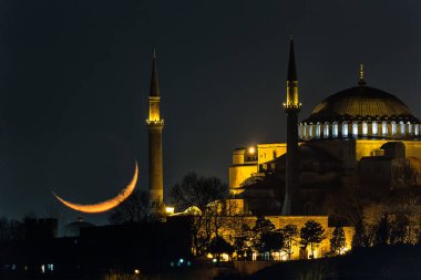 The crescent moon over Hagia Sophia is officially the Hagia Sophia Grand Mosque in Istanbul, Turkey.