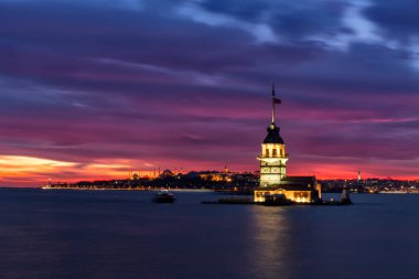 Istanbul, Turkey-July 27, 2019: illuminated Maiden's Tower at the sunset