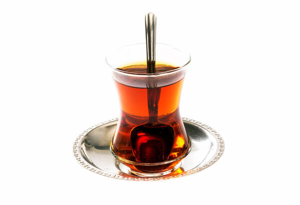 turkish tea and a spoon on a white background
