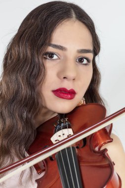beautiful young woman with the violin on white background 