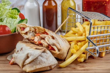 closeup view of Turkish shawarma with french fries  