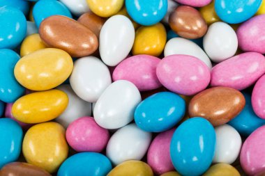 close-up view of the colorful candies covered with glaze