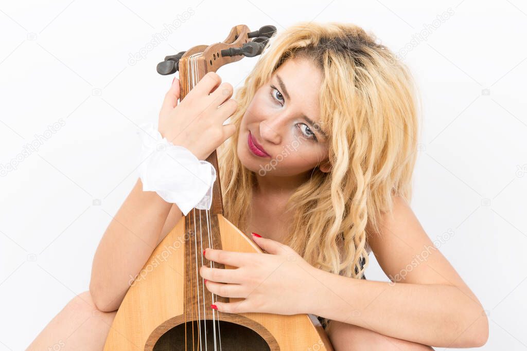 Blonde lady playing the oud musical instrument