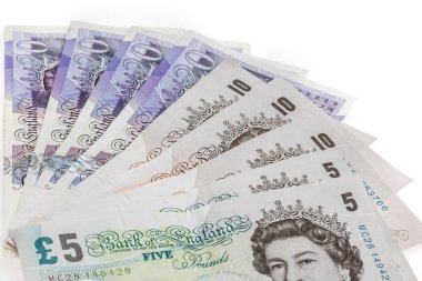 İngiltere sterlini, Birleşik Krallık 'ın parası beyaza yakın, İngiliz sterlini. Arkaplan İngiliz para birimi, Birleşik Krallık 'ın notlarının yakın planıyla kavramsallaştırıldı